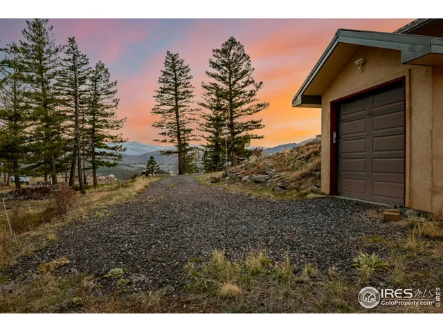 a view of a backyard of the house