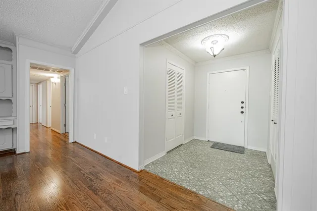 an empty room with wooden floor