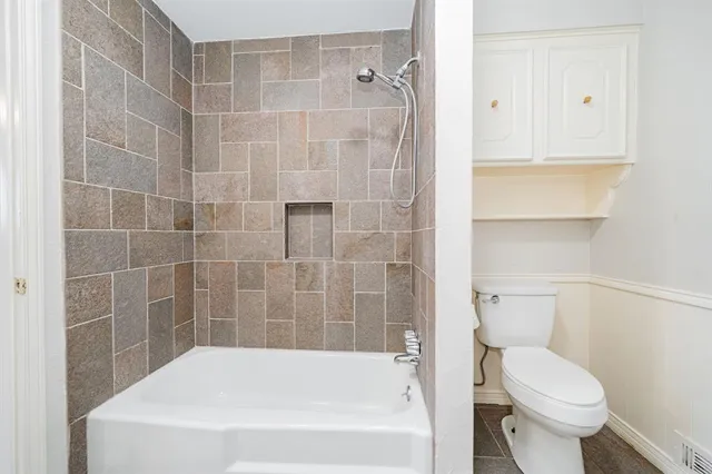 a spacious bathroom with a double vanity sink and a mirror