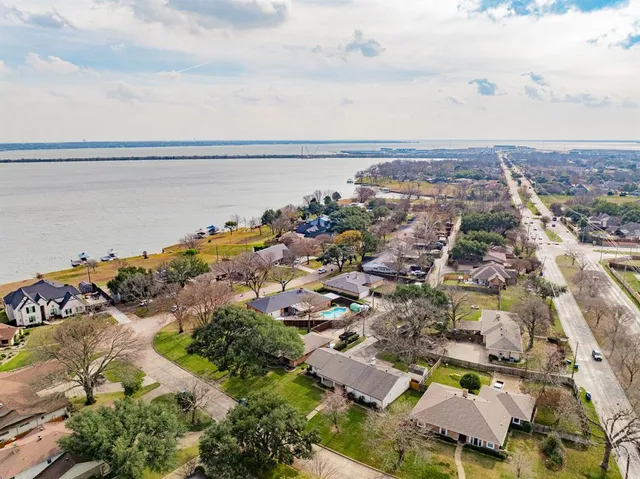 an aerial view of residential building with green space