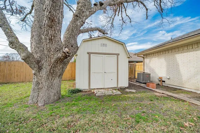 a view of a backyard of the house