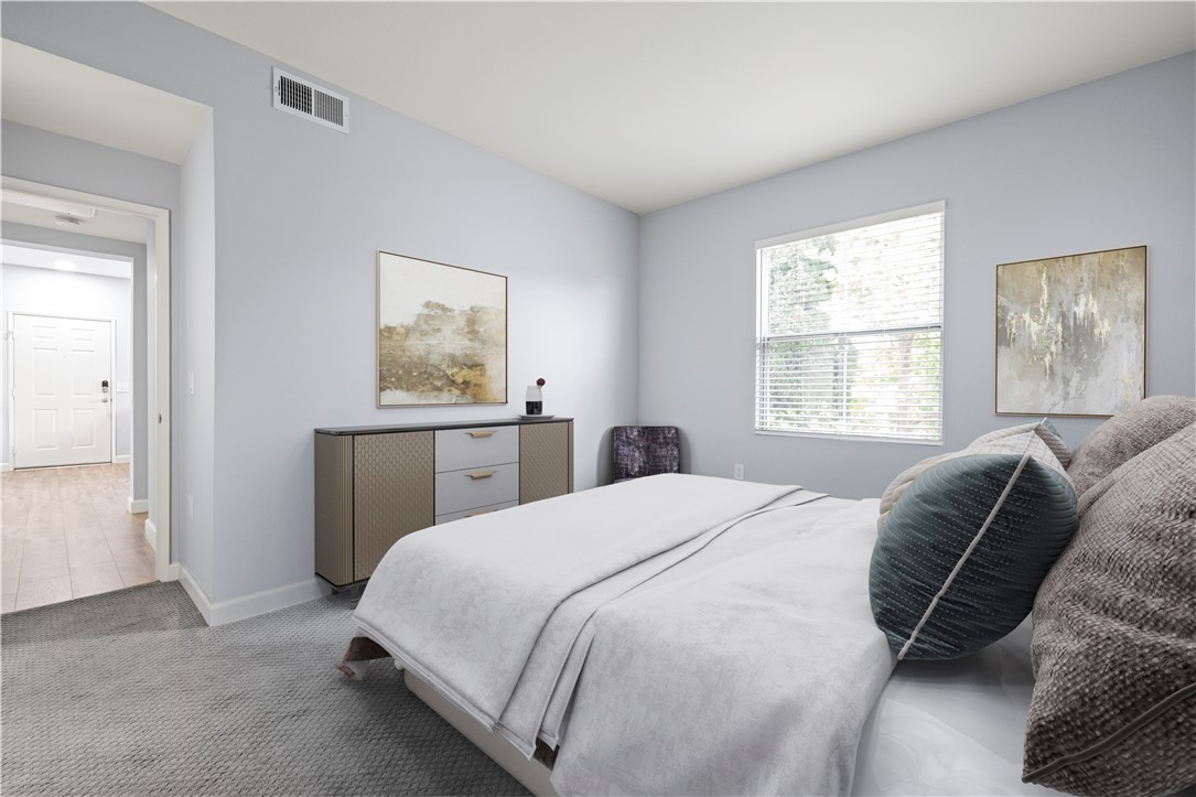 20000 Plum Canyon Road, Unit 1326 Saugus, CA 91350 - Photo 24 of 39 a bedroom with a bed and a window