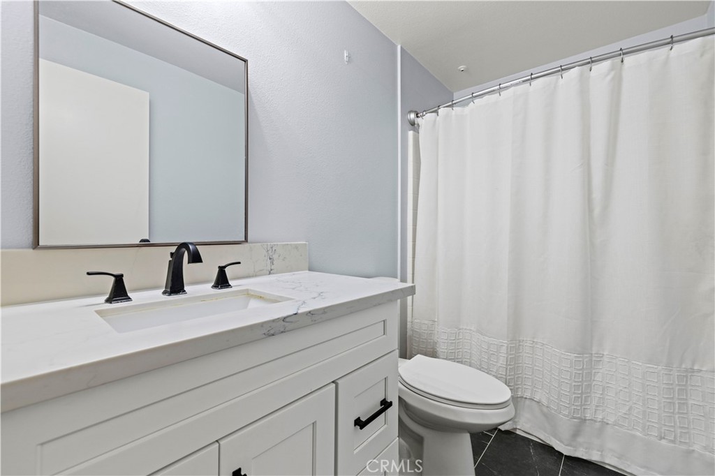 20000 Plum Canyon Road, Unit 1326 Saugus, CA 91350 - Photo 27 of 39 a bathroom with a sink and a toilet