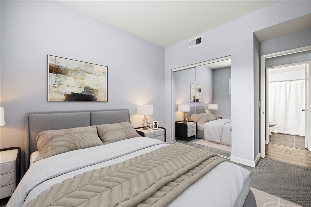 20000 Plum Canyon Road, Unit 1326 Saugus, CA 91350 - Photo 29 of 39 a bedroom with a bed and a large mirror