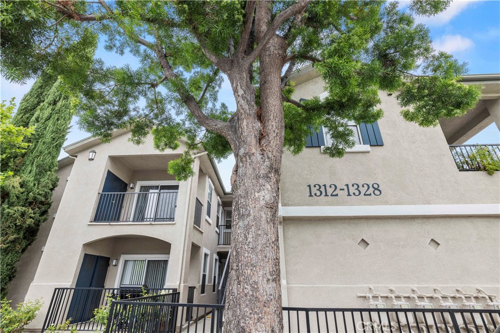 20000 Plum Canyon Road, Unit 1326 Saugus, CA 91350 - Photo 3 of 39 a sign on the side of a building