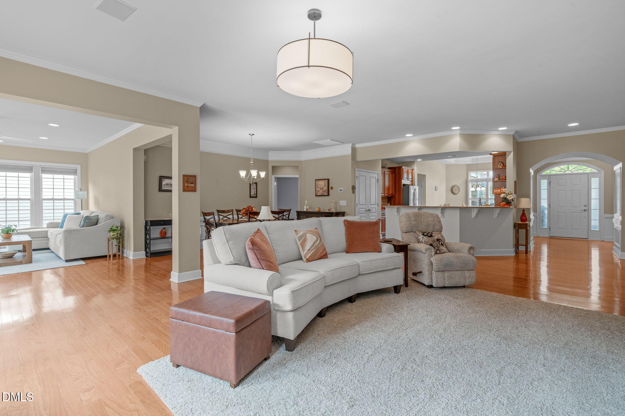 113 Beckingham Loop Cary, NC 27519 - Photo 12 of 57 a living room with furniture and a dining table with wooden floor
