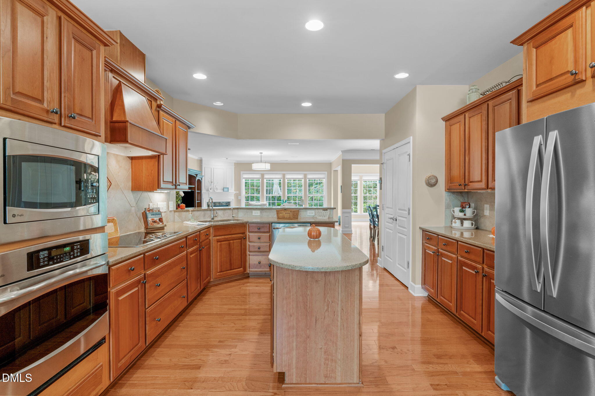 113 Beckingham Loop Cary, NC 27519 - Photo 22 of 57 a large kitchen with stainless steel appliances granite countertop a refrigerator a stove top oven a sink and dishwasher