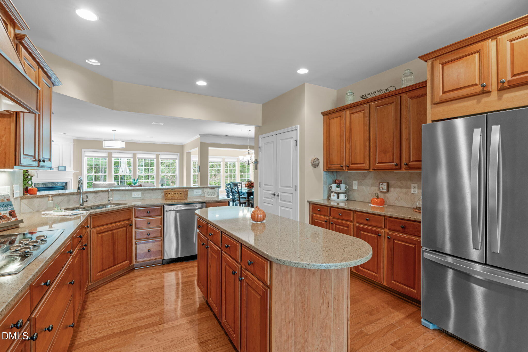113 Beckingham Loop Cary, NC 27519 - Photo 23 of 57 a kitchen with stainless steel appliances granite countertop a sink stove and refrigerator