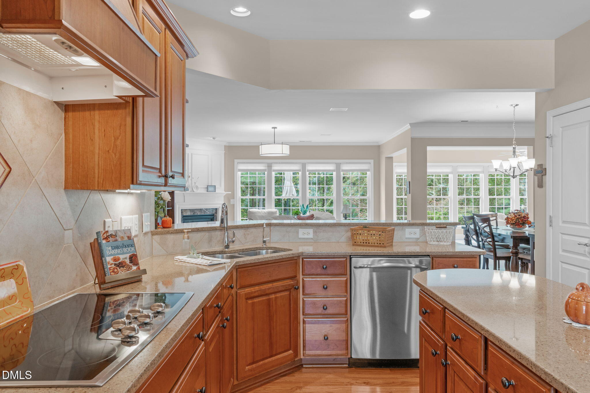 113 Beckingham Loop Cary, NC 27519 - Photo 24 of 57 a kitchen with stainless steel appliances granite countertop a sink stove and cabinets