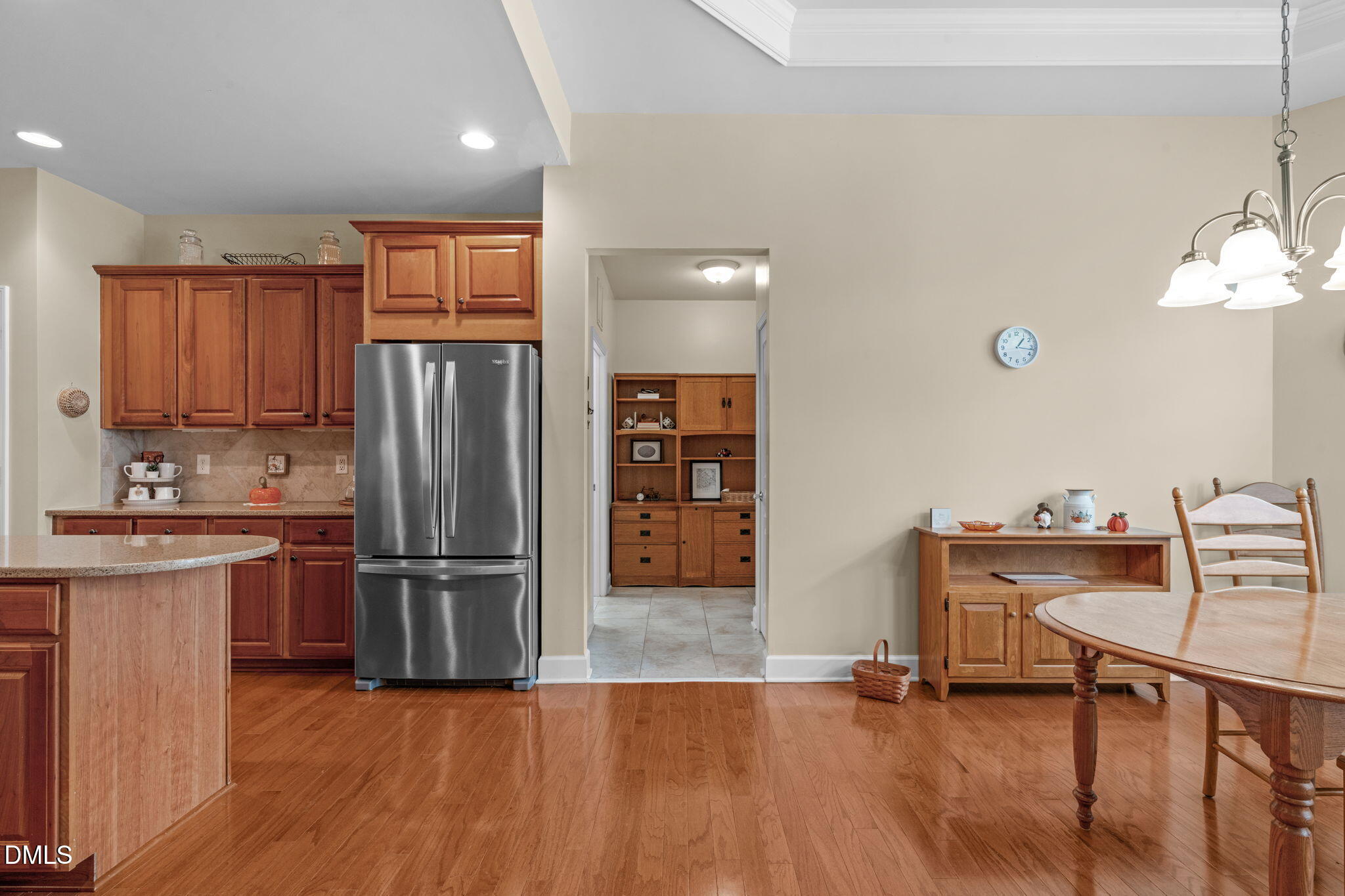 113 Beckingham Loop Cary, NC 27519 - Photo 25 of 57 a kitchen with refrigerator cabinets and wooden floor