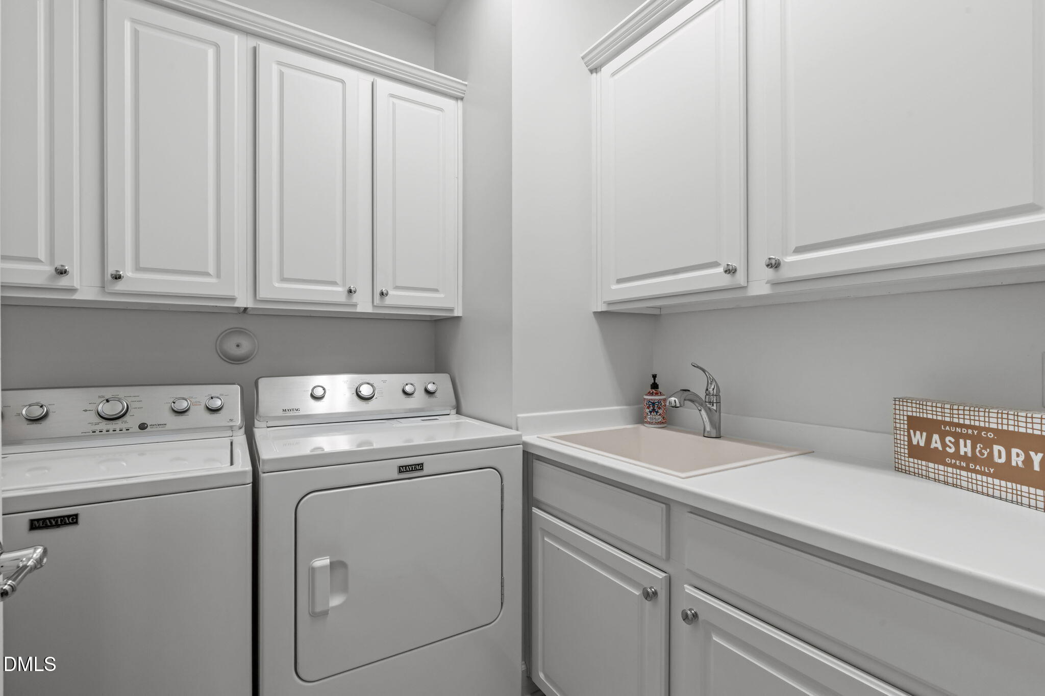 113 Beckingham Loop Cary, NC 27519 - Photo 30 of 57 a utility room with dryer and washer
