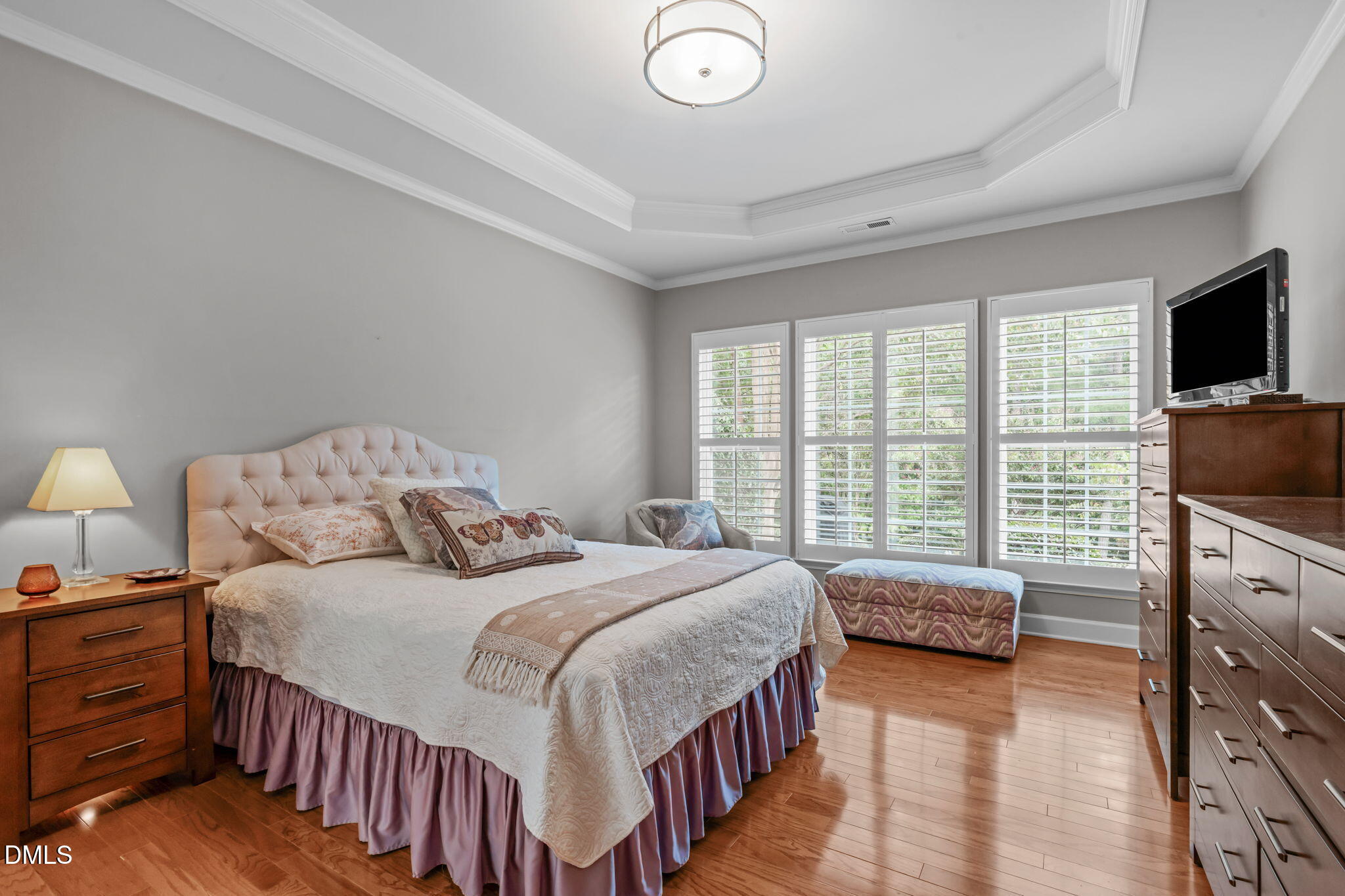 113 Beckingham Loop Cary, NC 27519 - Photo 31 of 57 a bedroom with a bed and a flat screen tv