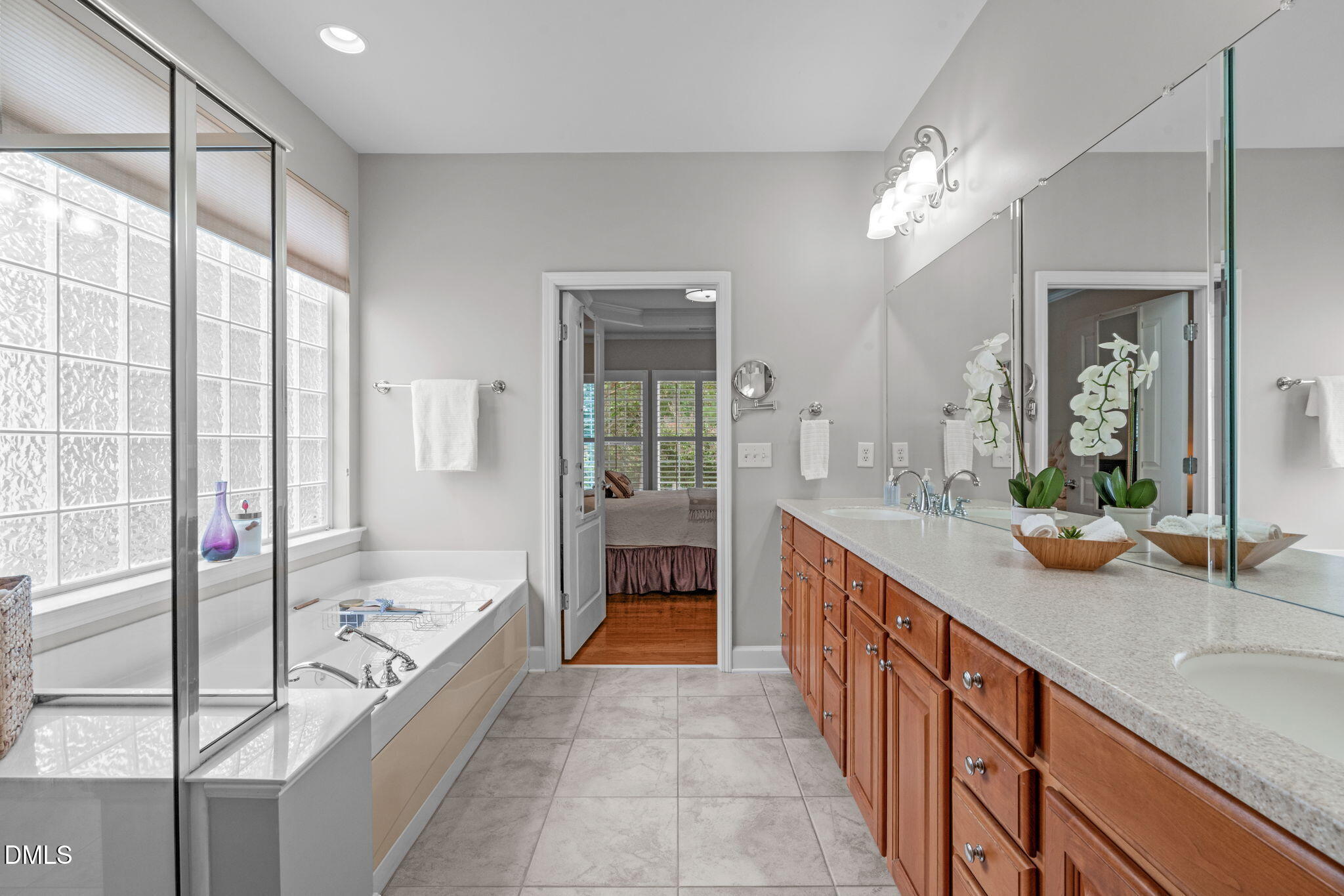 113 Beckingham Loop Cary, NC 27519 - Photo 34 of 57 a large spacious bathroom with a tub sink and mirror