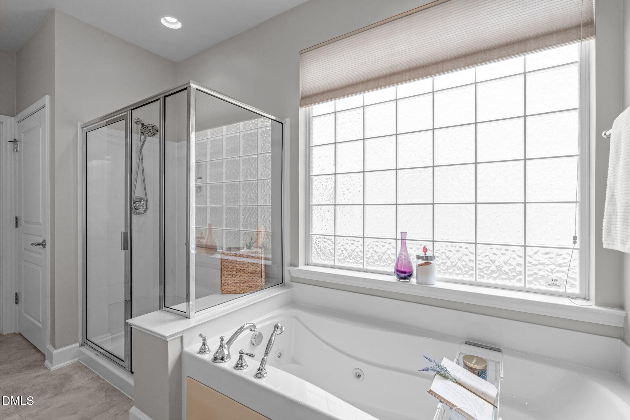 113 Beckingham Loop Cary, NC 27519 - Photo 35 of 57 a bathroom with a bathtub and next to a window