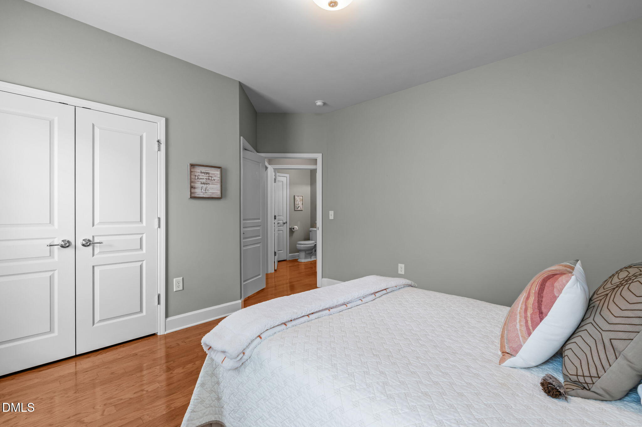 113 Beckingham Loop Cary, NC 27519 - Photo 38 of 57 a bedroom with a bed and wooden floor