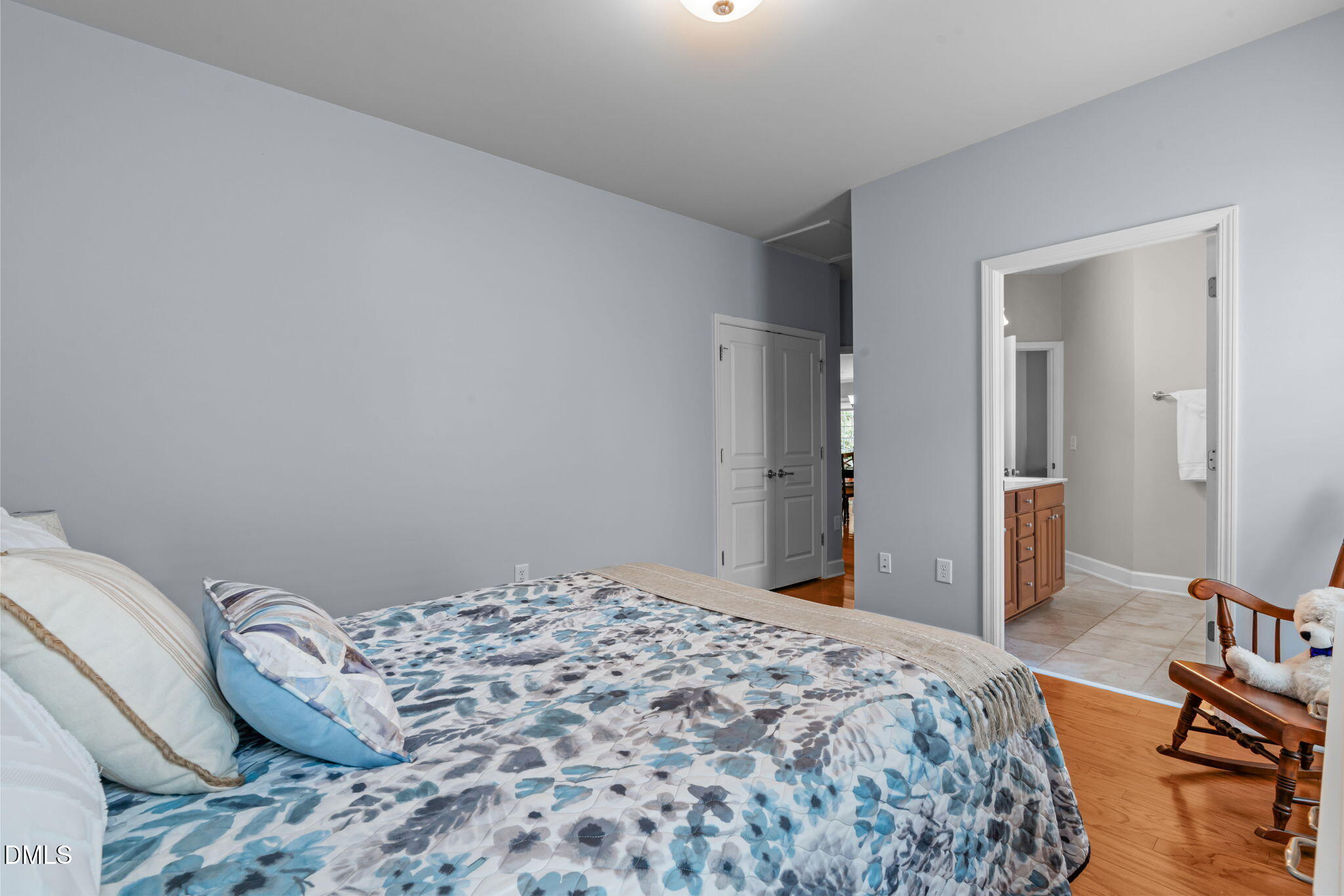 113 Beckingham Loop Cary, NC 27519 - Photo 42 of 57 a bedroom with a bed and mirror