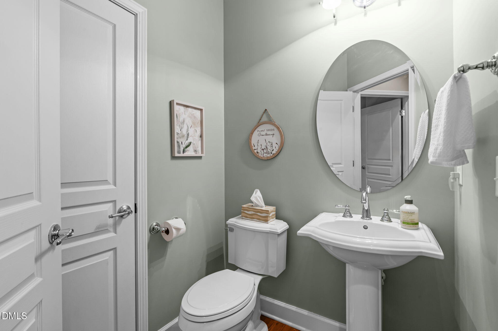 113 Beckingham Loop Cary, NC 27519 - Photo 43 of 57 a bathroom with a toilet a sink and mirror