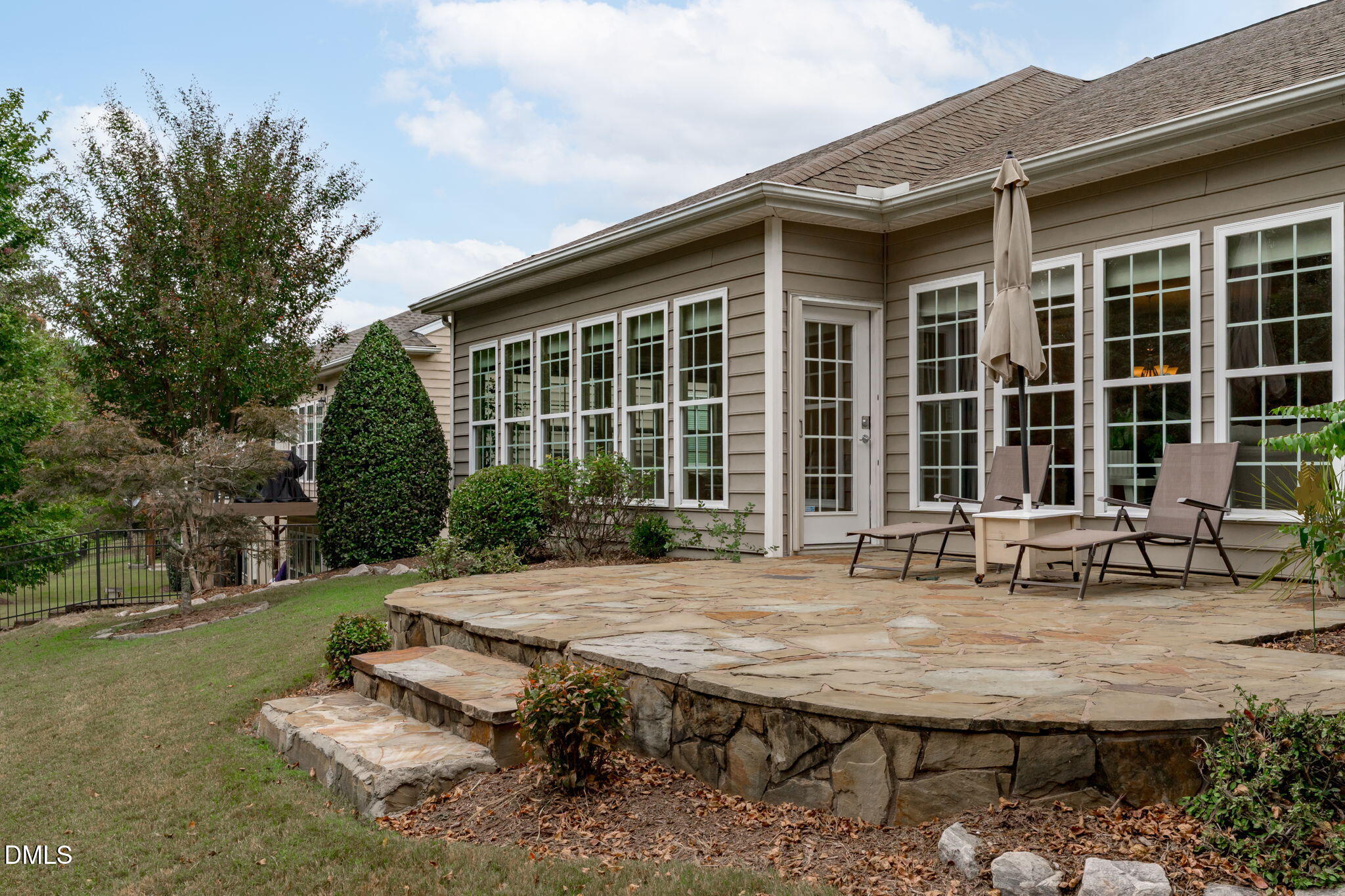 113 Beckingham Loop Cary, NC 27519 - Photo 46 of 57 a view of a house with backyard sitting area and garden