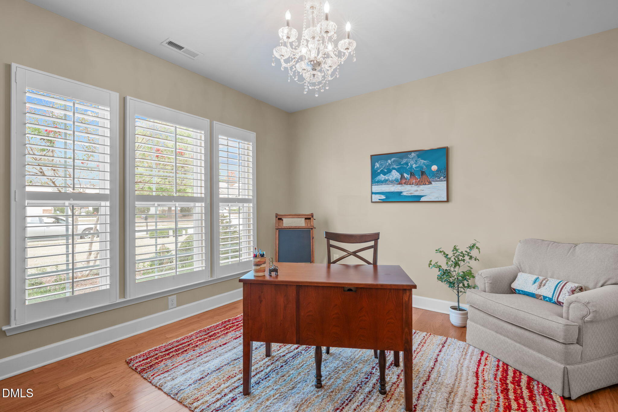 113 Beckingham Loop Cary, NC 27519 - Photo 7 of 57 a living room with furniture and a chandelier