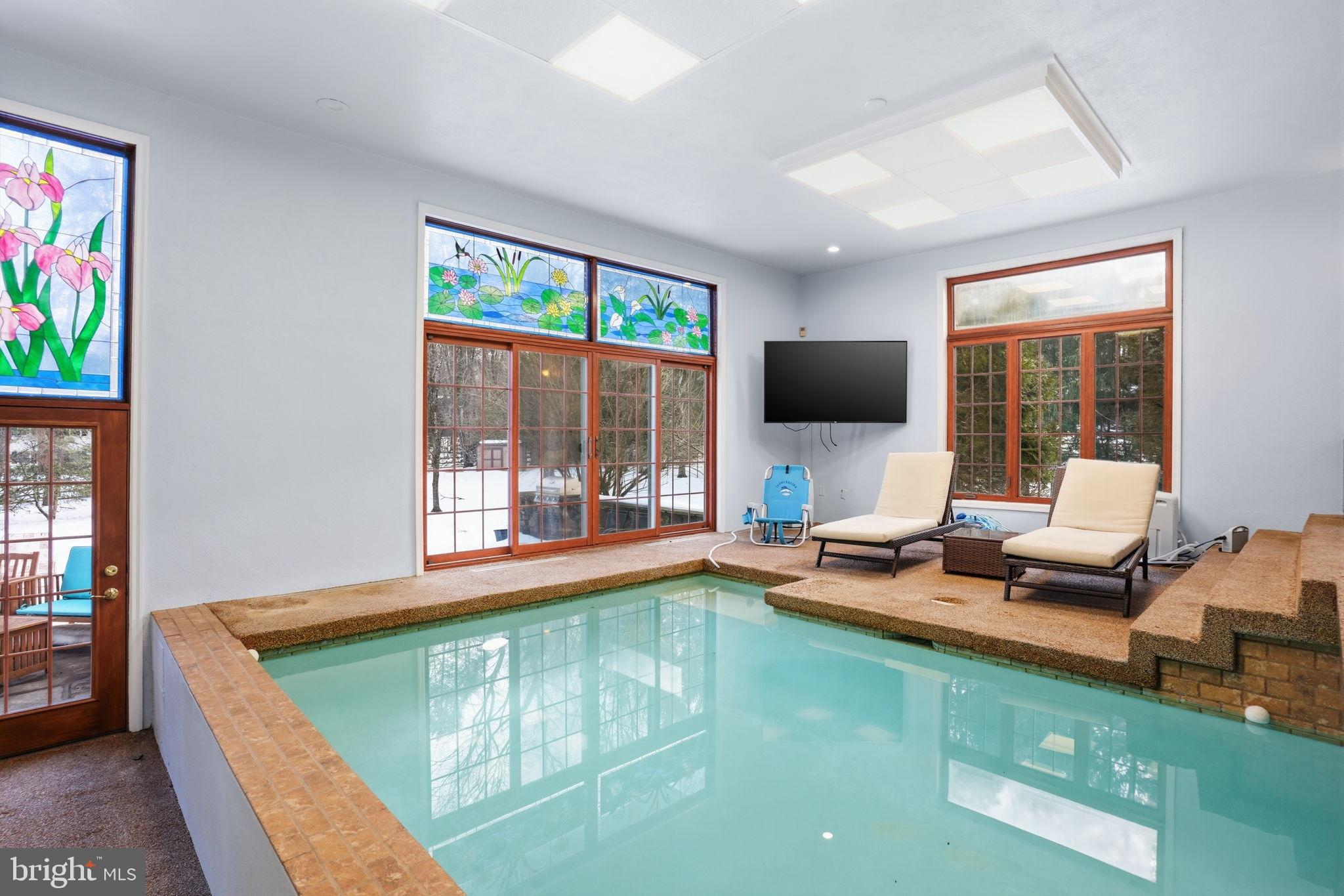 244 Mathers Road Ambler, PA 19002 - Photo 68 of 96 Indoor oasis with serene pool and views.