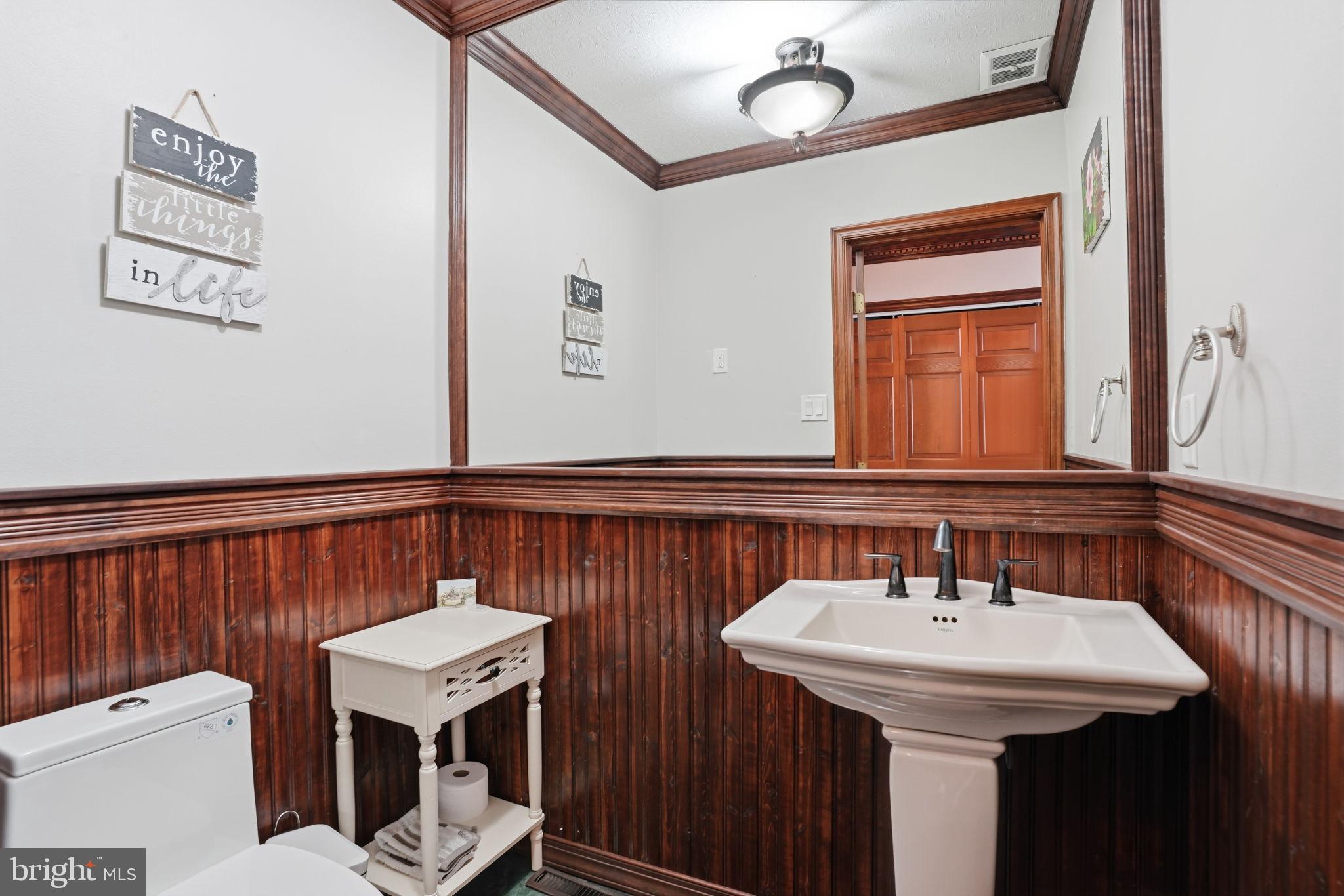 244 Mathers Road Ambler, PA 19002 - Photo 9 of 96 Charming half-bath with rich wood accents.