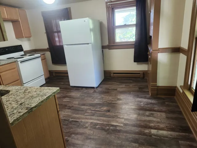 a refrigerator freezer sitting inside of a kitchen