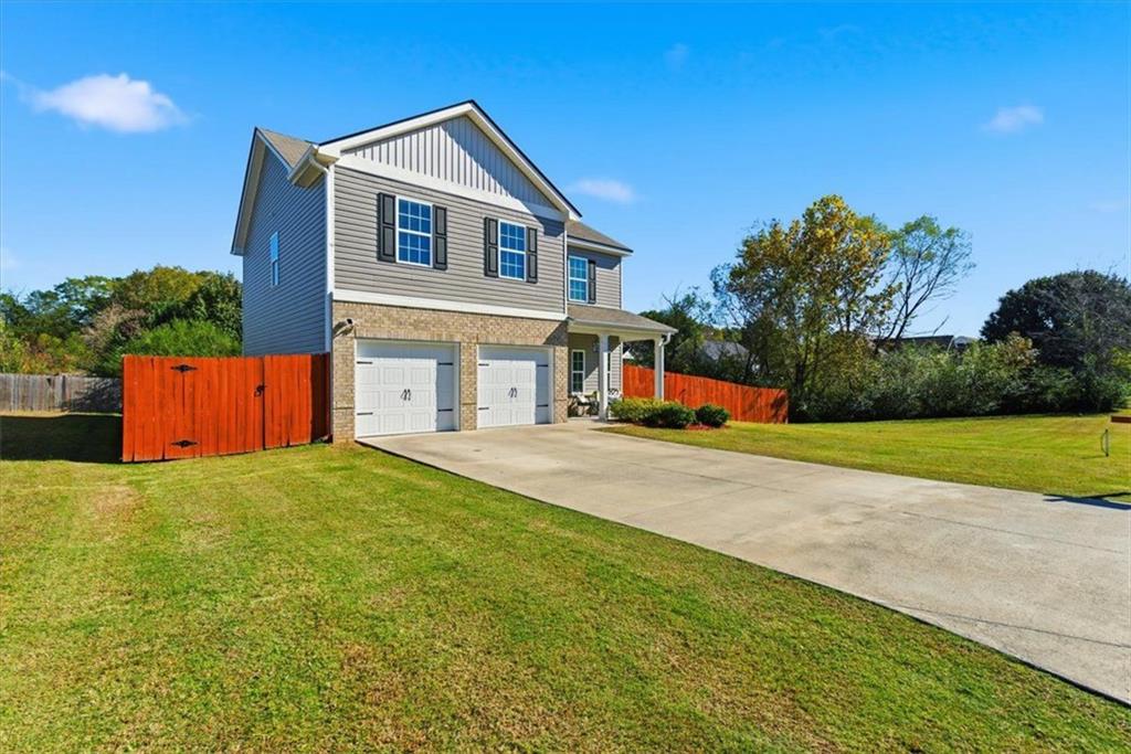 176 Village Way Southwest Calhoun, GA 30701 - Photo 2 of 53 a front view of house with yard and trees