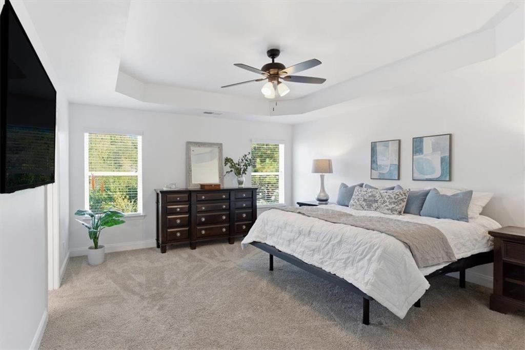 176 Village Way Southwest Calhoun, GA 30701 - Photo 24 of 53 a bedroom with a bed and a chandelier