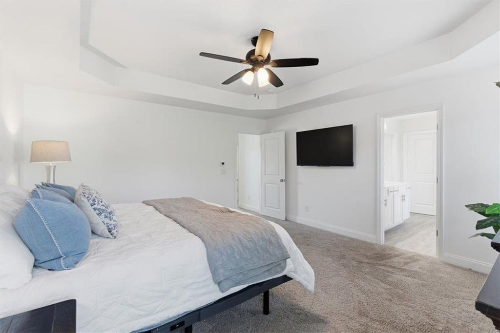 176 Village Way Southwest Calhoun, GA 30701 - Photo 25 of 53 a bedroom with a bed tv and a window