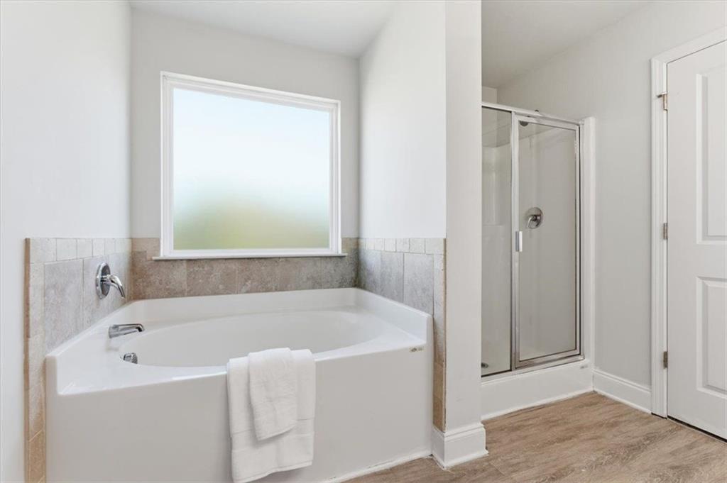 176 Village Way Southwest Calhoun, GA 30701 - Photo 29 of 53 a white bath tub sitting next to a shower
