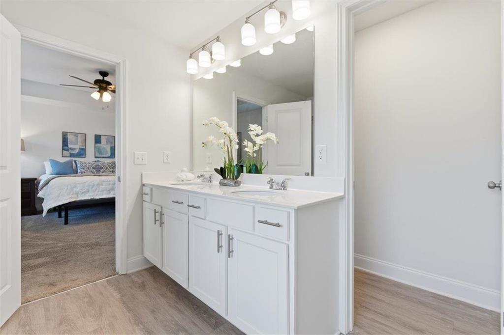 176 Village Way Southwest Calhoun, GA 30701 - Photo 31 of 53 a spacious bathroom with a double vanity sink and a mirror