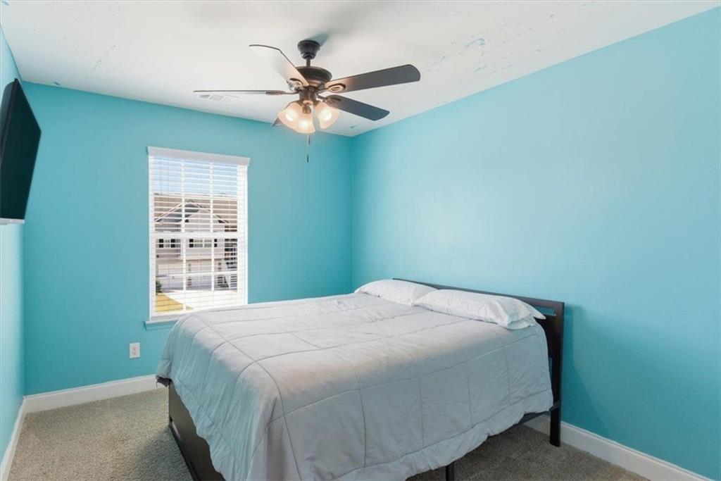 176 Village Way Southwest Calhoun, GA 30701 - Photo 32 of 53 a bedroom with a bed and a chandelier