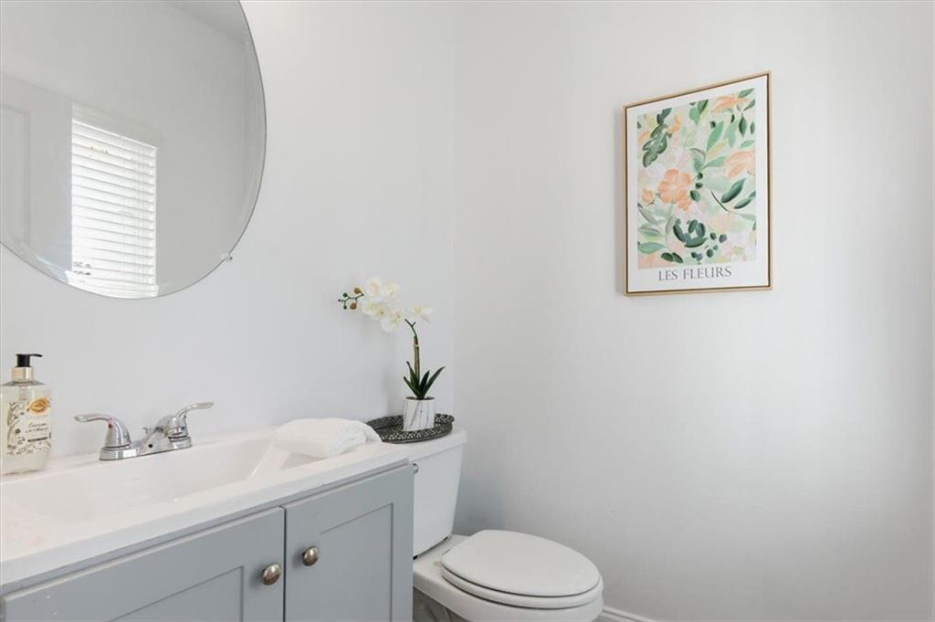 176 Village Way Southwest Calhoun, GA 30701 - Photo 35 of 53 a bathroom with a toilet sink and mirror