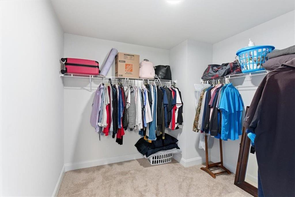 176 Village Way Southwest Calhoun, GA 30701 - Photo 39 of 53 a view of walk in closet with clothes