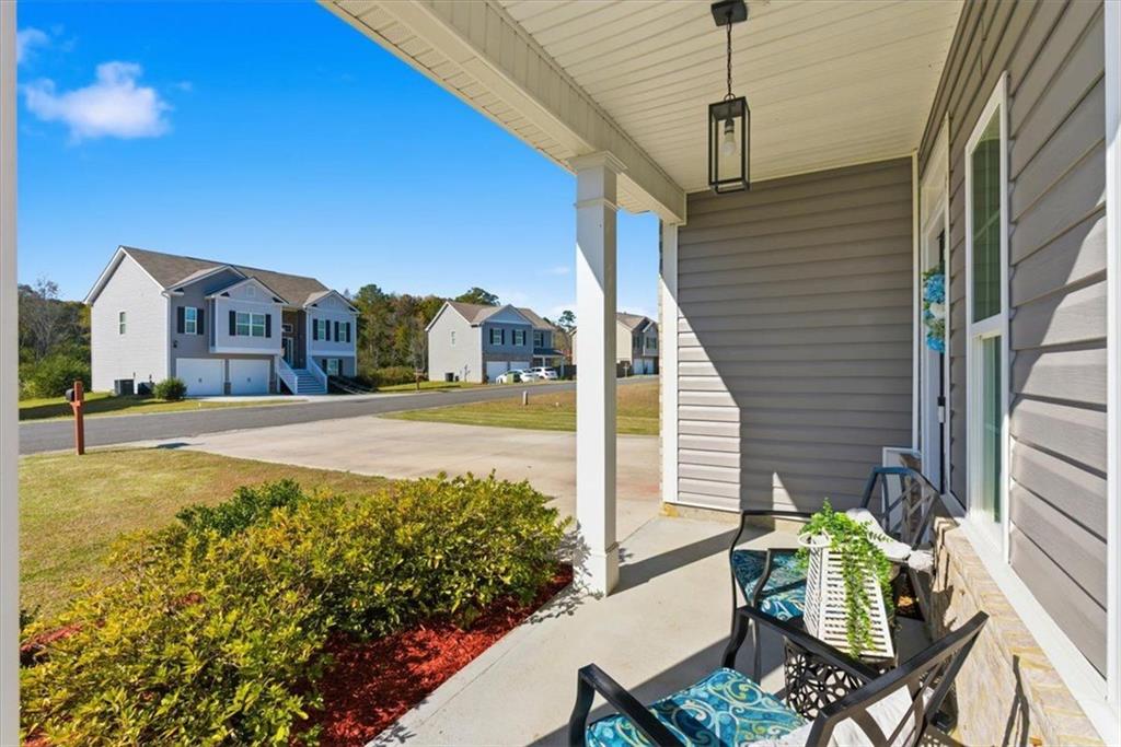 176 Village Way Southwest Calhoun, GA 30701 - Photo 7 of 53 a view of a house with backyard and sitting area