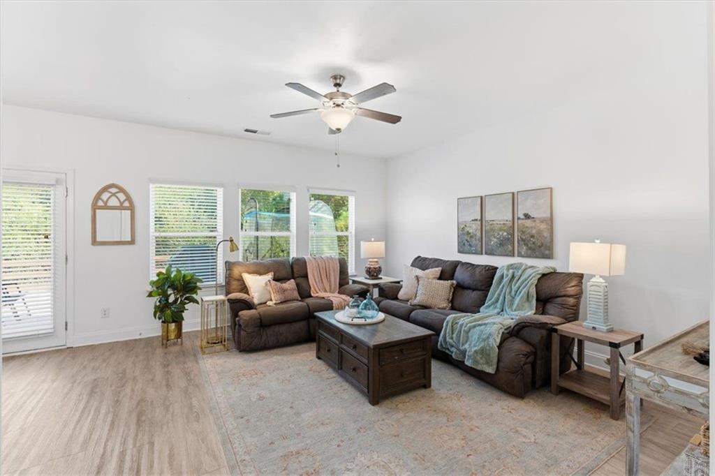 176 Village Way Southwest Calhoun, GA 30701 - Photo 10 of 53 a living room with furniture and windows