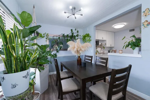 a view of a dining room with furniture and wooden floor