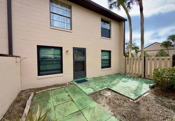 a view of a backyard of the house