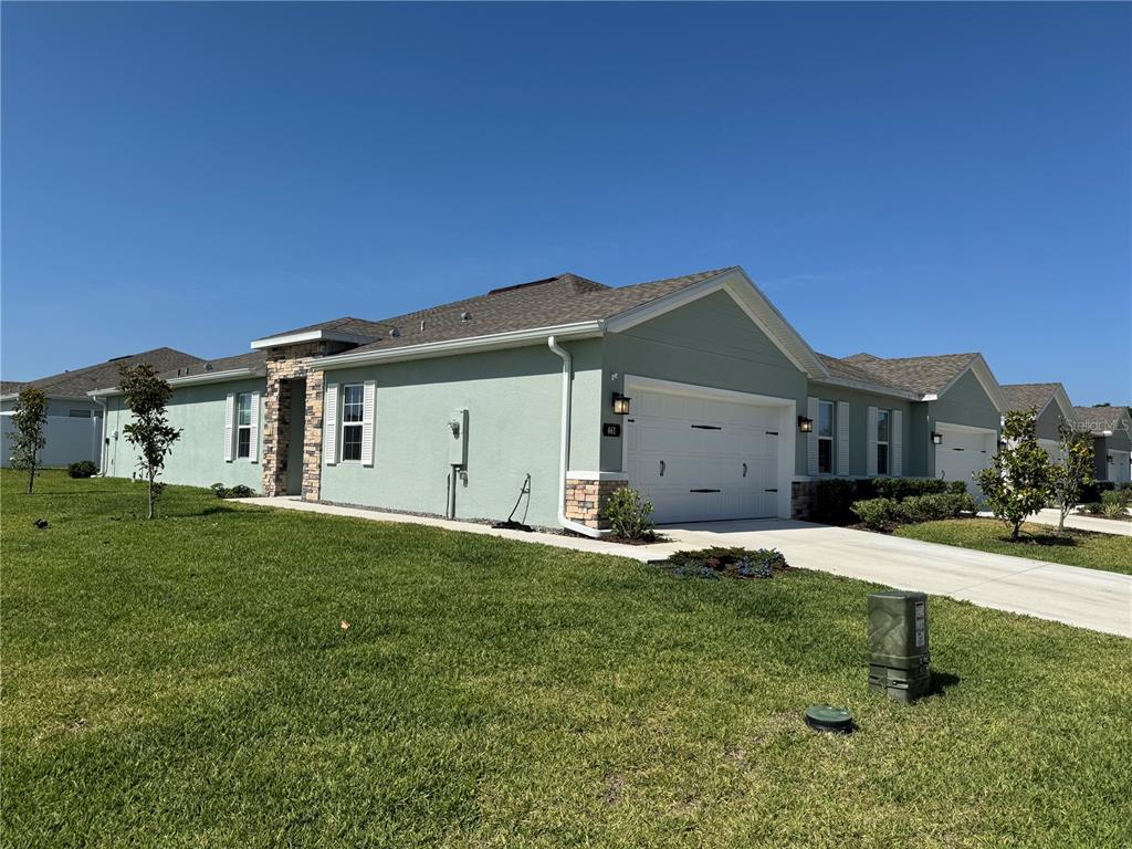 a house view with a garden space