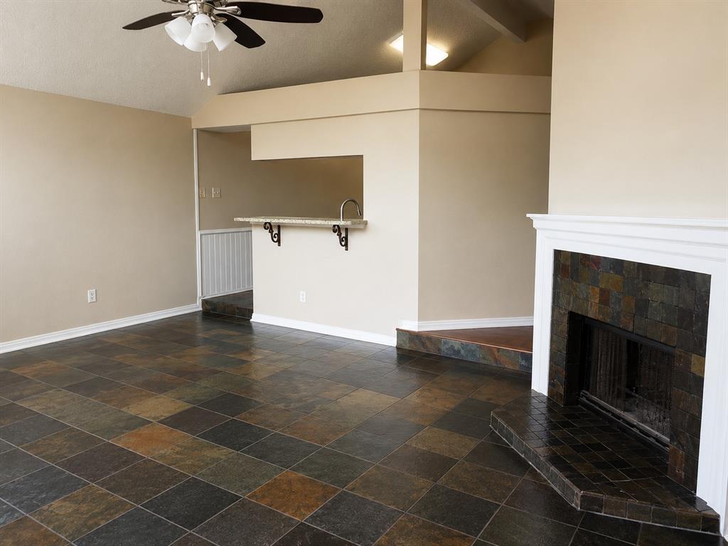 7972 Shield Road Frisco, TX 75035 - Photo 5 of 16 Ai Modified- Step down into living area and step up into kitchen.