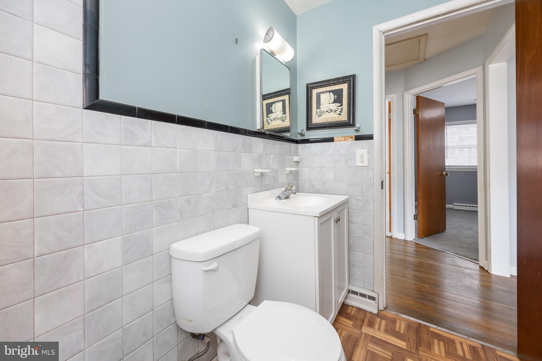 310 Zion Road Salisbury, MD 21804 - Photo 18 of 40 a bathroom with a toilet a sink and mirror