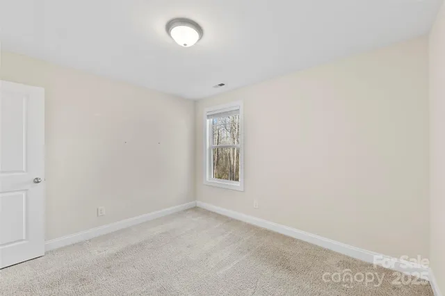 a front view of a house with yard and garage