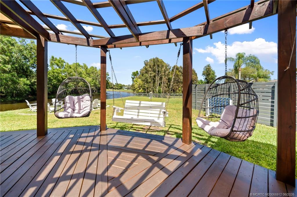4401 Southeast Satinleaf Place Stuart, FL 34997 - Photo 36 of 51 Beautiful Patio and Pergola Overlooking the Lake