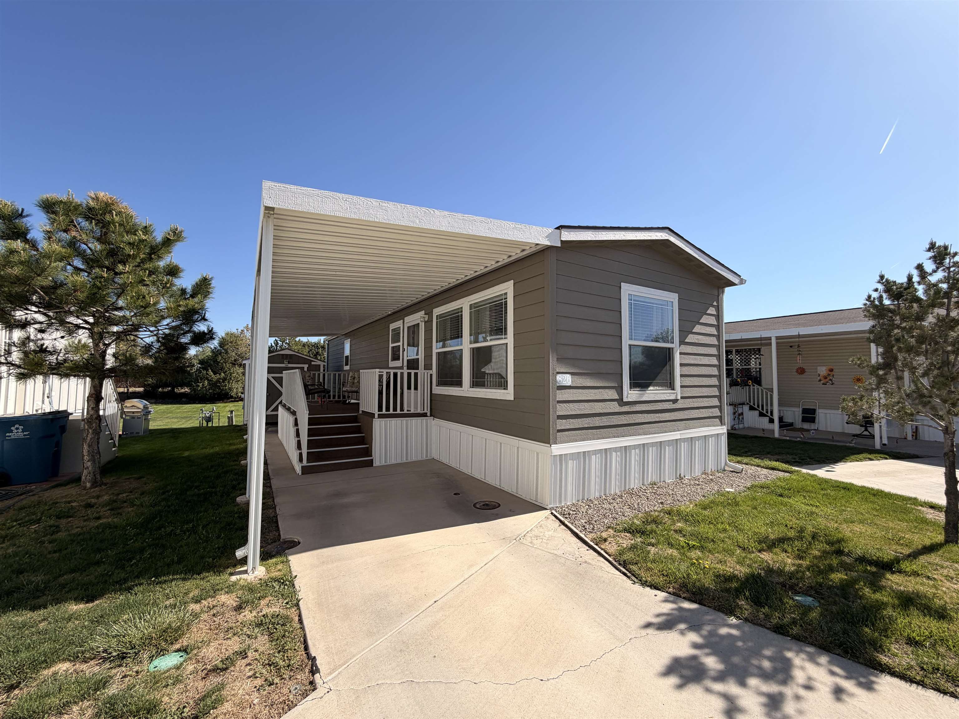 435 32 Road, Unit 826 Clifton, CO 81520 - Photo 1 of 17 a front view of a house with a yard