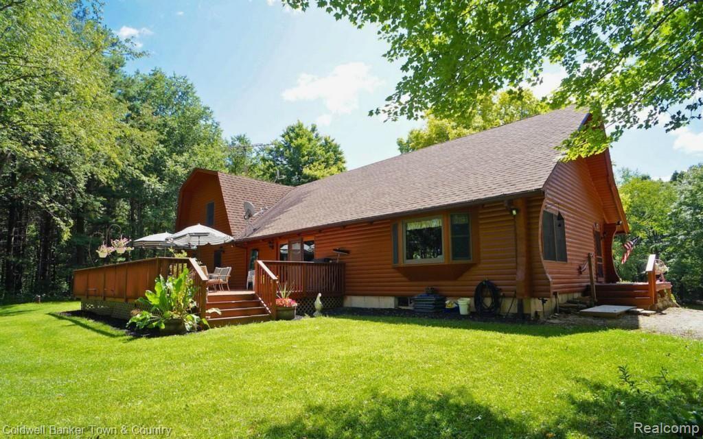 6255 North Owosso Road Fowlerville, MI 48836 - Photo 3 of 31 Large deck on back of home ideal for views of this secluded property - wild turkeys, deer and wildlife call it home!