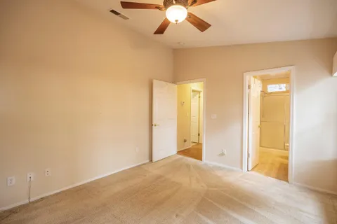 a view of a room with a ceiling fan