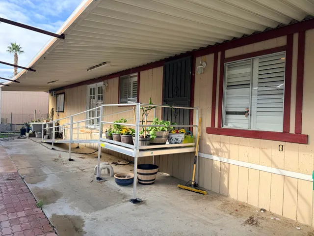 a balcony with furniture and window