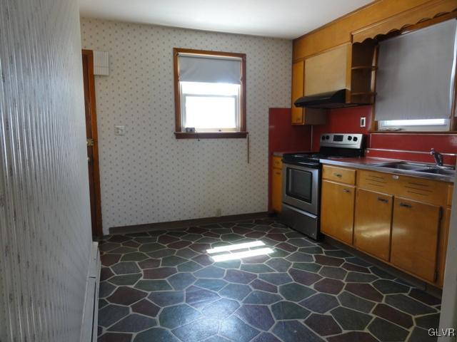 4541 Newburg Road Nazareth, PA 18064 - Photo 7 of 20 a kitchen with a stove a sink and a refrigerator