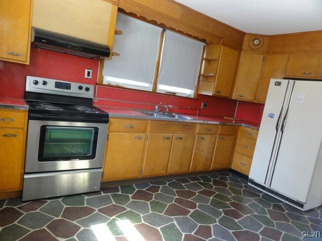4541 Newburg Road Nazareth, PA 18064 - Photo 8 of 20 a kitchen with a stove top oven and cabinets