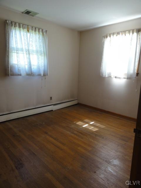 4541 Newburg Road Nazareth, PA 18064 - Photo 9 of 20 an empty room with wooden floor and windows
